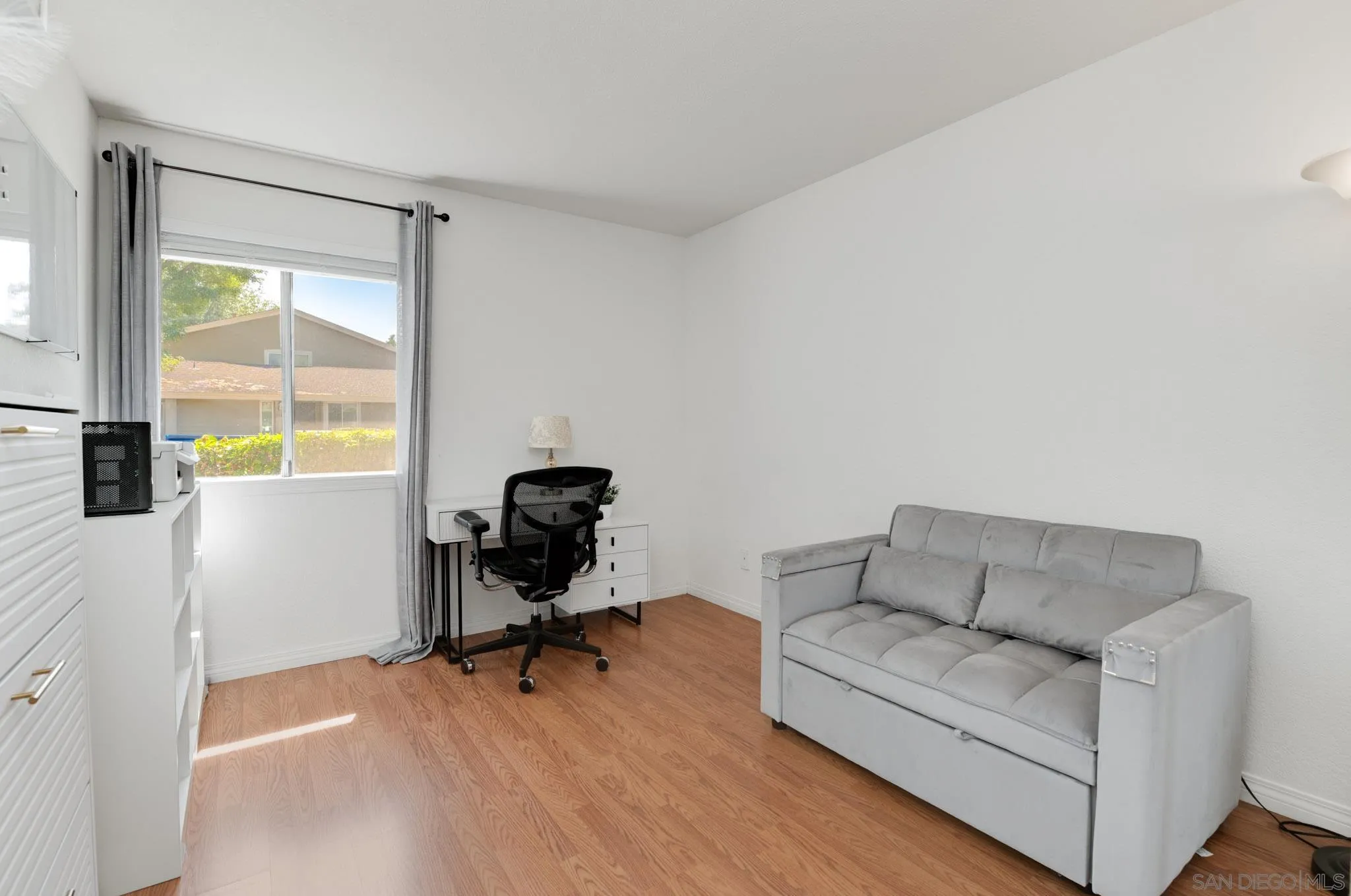 1536 Gustavo Street, Unit A El Cajon, CA 92019 - Photo 18 of 28 a living room with furniture and a window