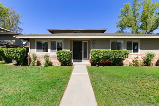 front view of a house and a yard