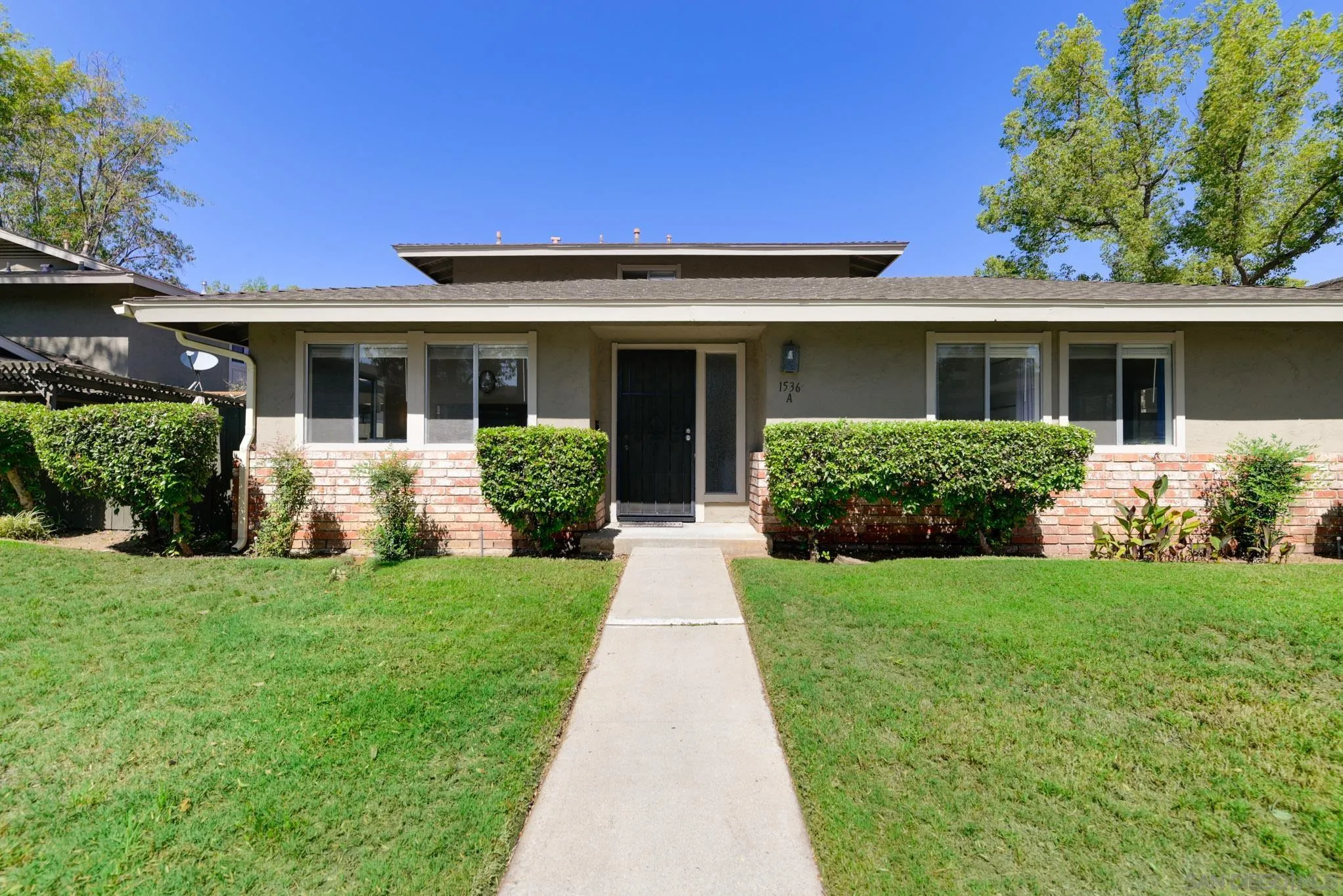 1536 Gustavo Street, Unit A El Cajon, CA 92019 - Photo 2 of 28 front view of a house and a yard