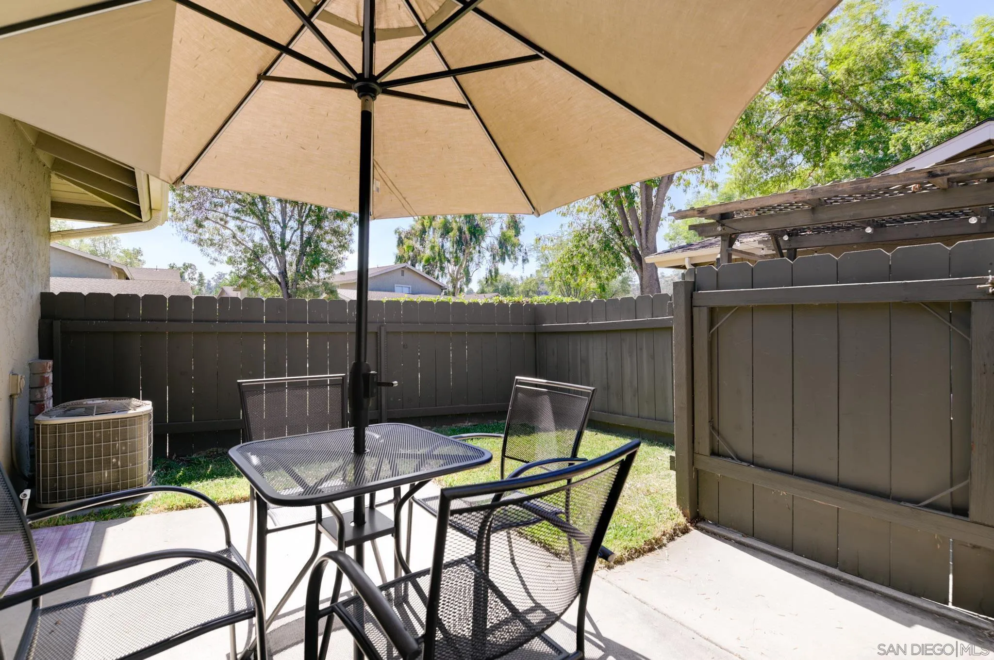 1536 Gustavo Street, Unit A El Cajon, CA 92019 - Photo 24 of 28 a patio with a yard table and chairs