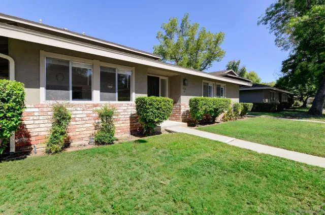 front view of a house with a yard