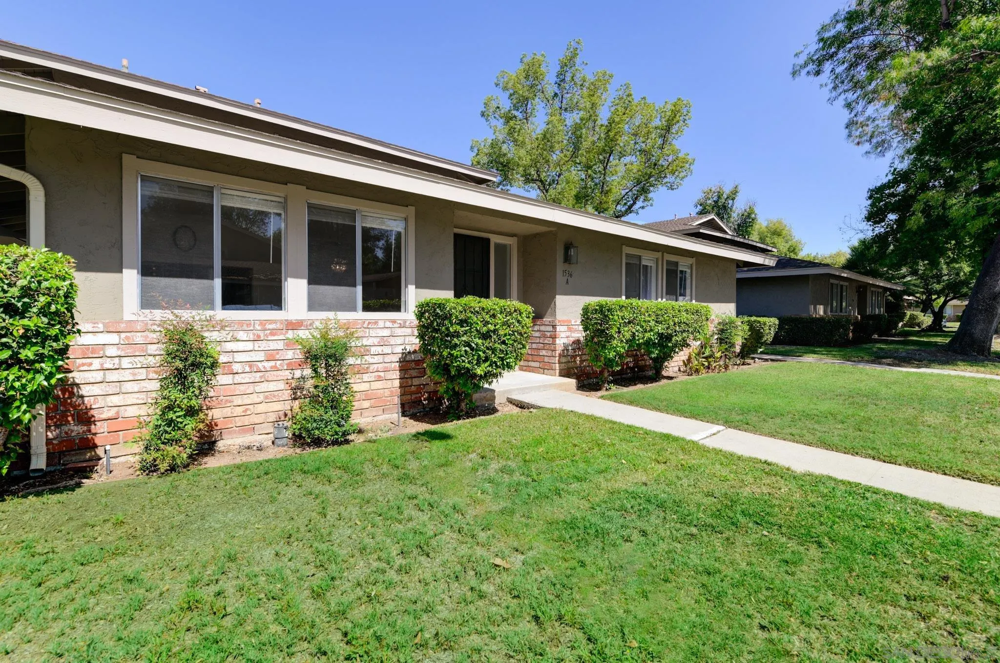 1536 Gustavo Street, Unit A El Cajon, CA 92019 - Photo 3 of 28 front view of a house with a yard