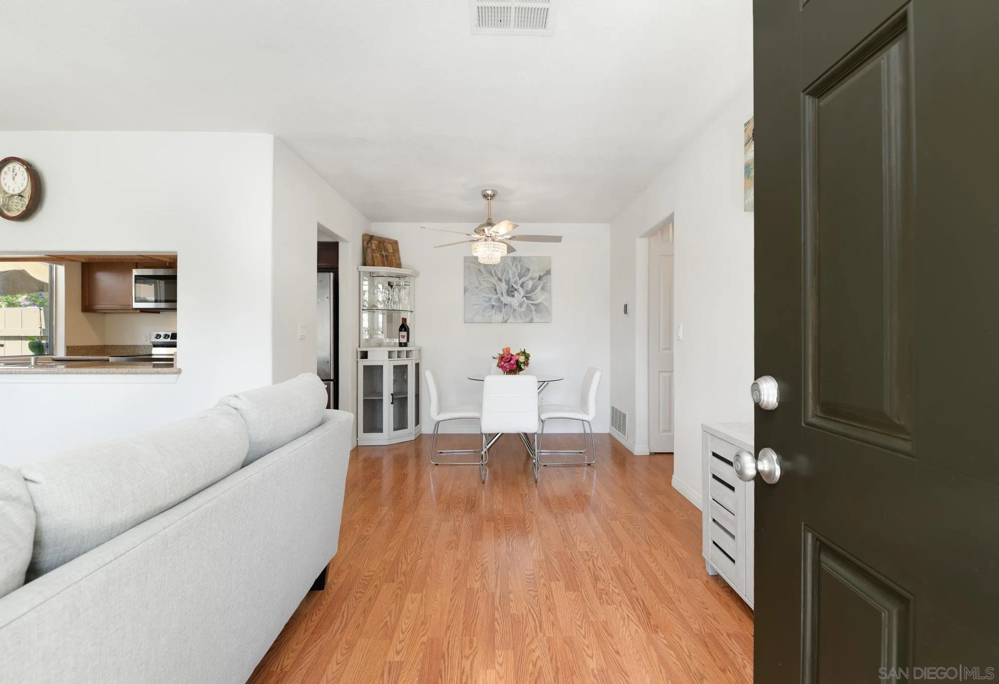 1536 Gustavo Street, Unit A El Cajon, CA 92019 - Photo 4 of 28 a living room with furniture and a chandelier