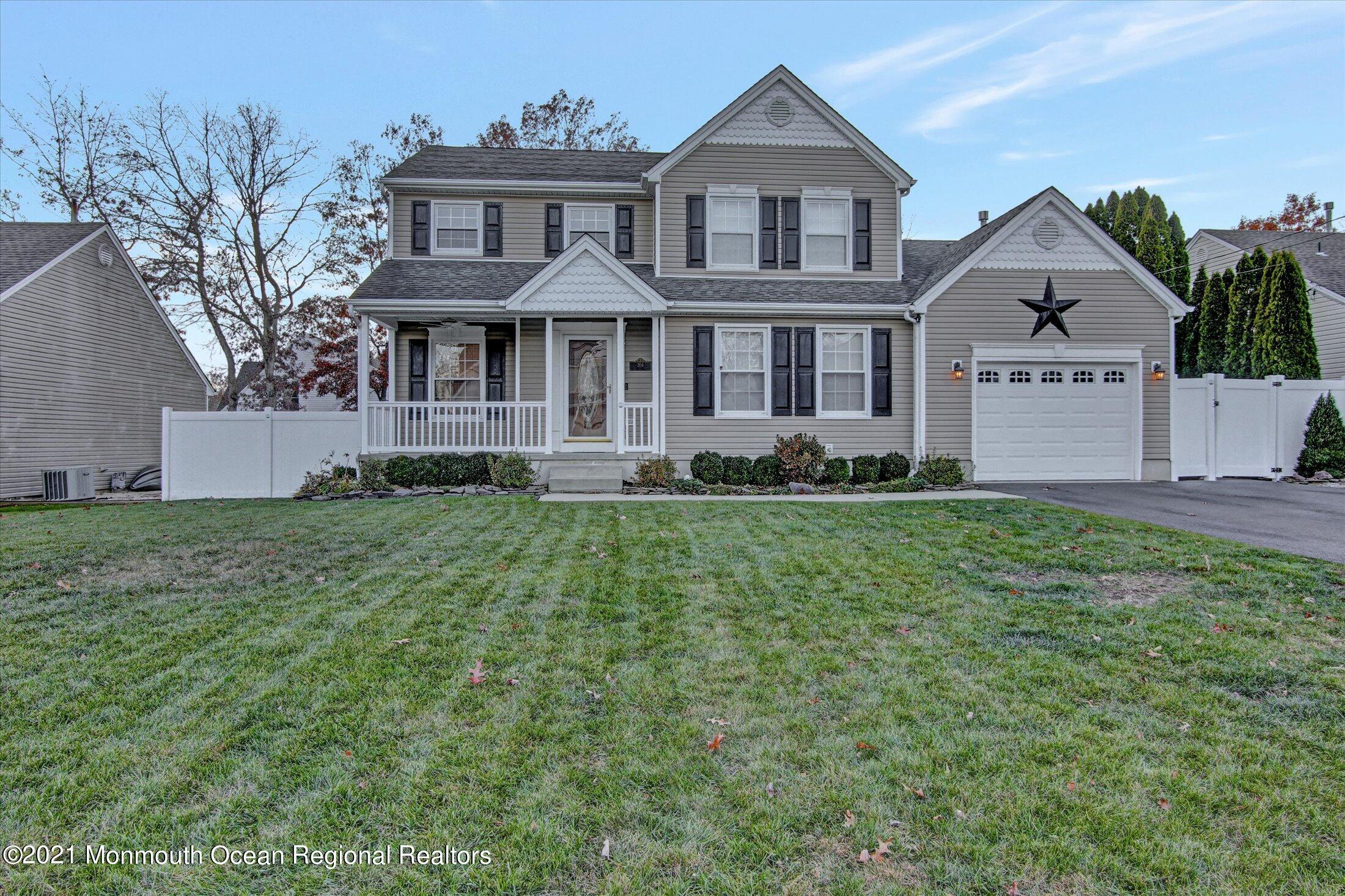 204 Schooner Road Manahawkin, NJ 08050 - Photo 1 of 34 a front view of a house with a yard