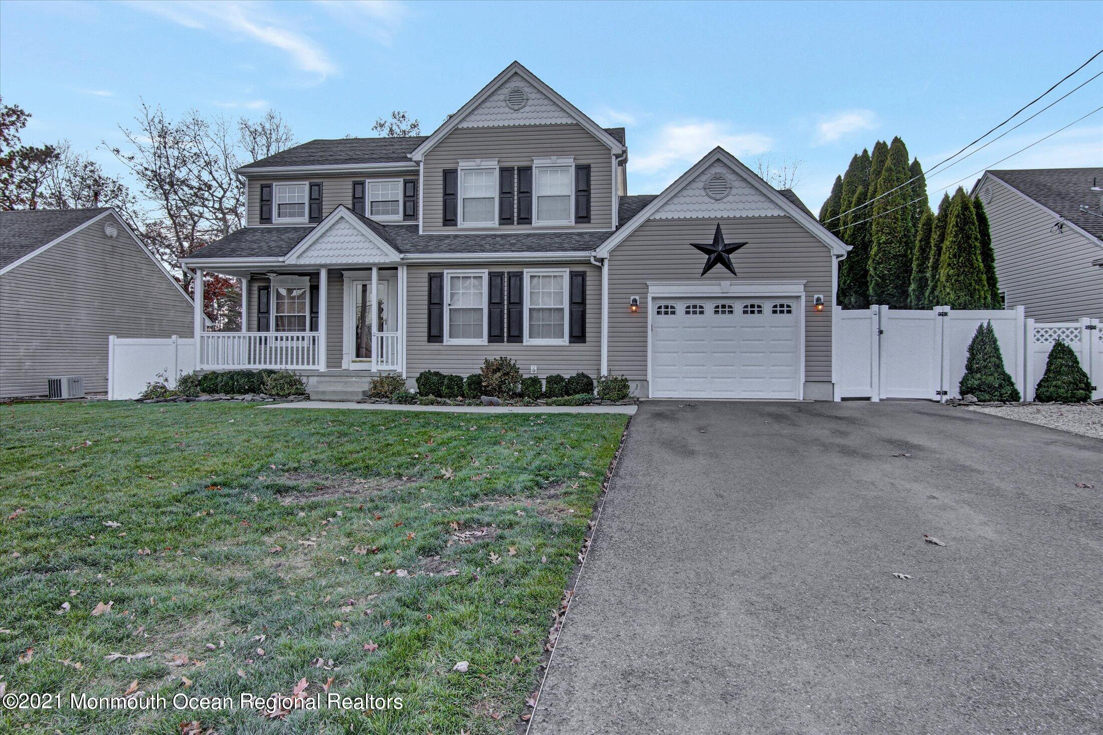 204 Schooner Road Manahawkin, NJ 08050 - Photo 3 of 34 a front view of a house with a yard