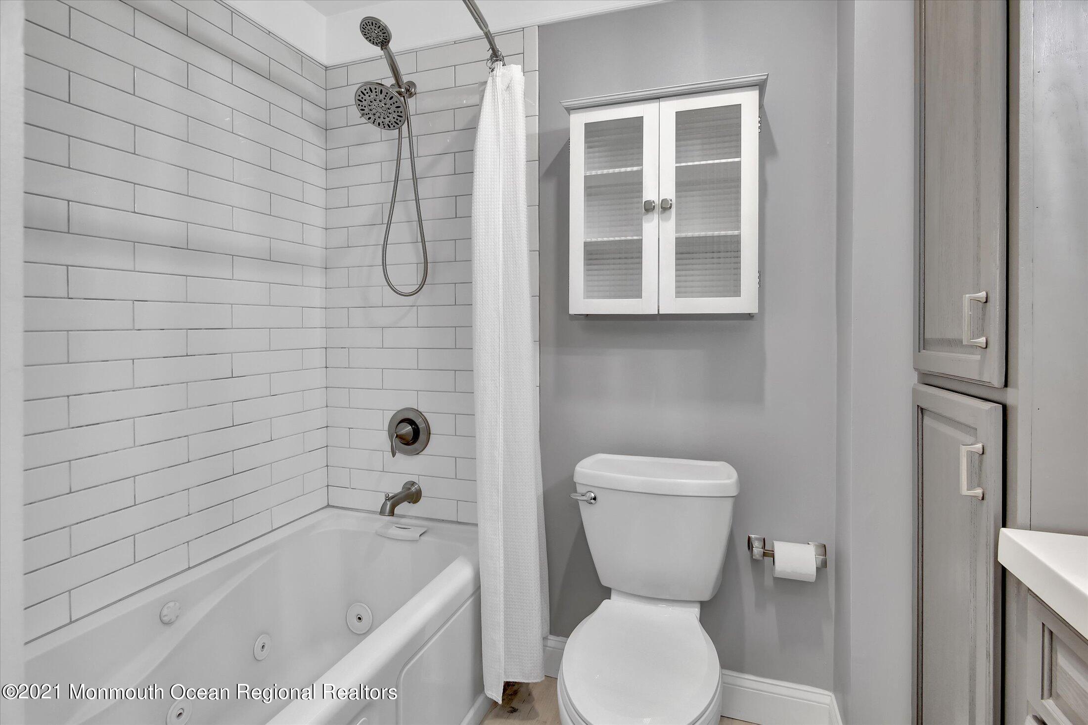 204 Schooner Road Manahawkin, NJ 08050 - Photo 22 of 34 a bathroom with a toilet and a shower
