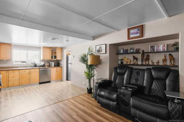 a bathroom with a sink mirror and toilet