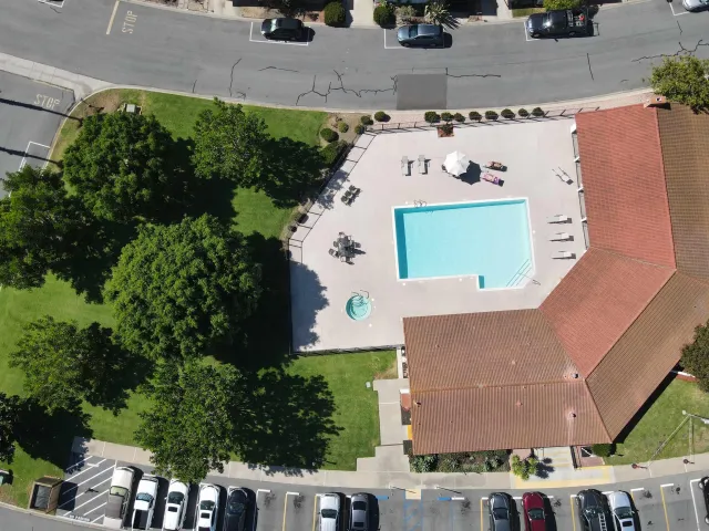 an aerial view of a house with a yard
