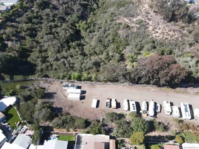 an aerial view of a houses with yard
