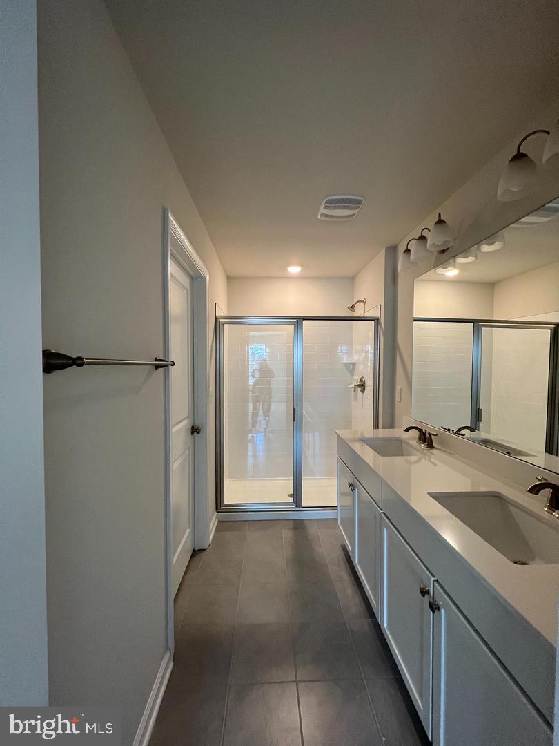 34 Roberta Wy. Medford, NJ 08055 - Photo 15 of 19 a spacious bathroom with a granite countertop sink a mirror and a shower