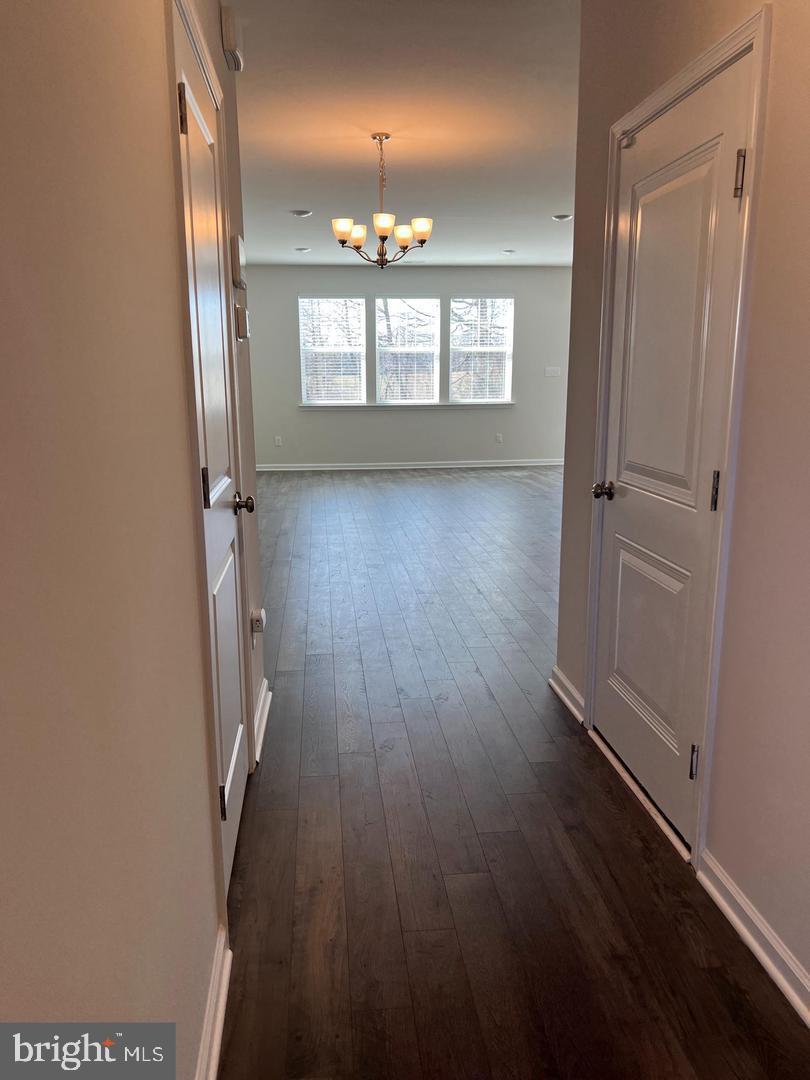 34 Roberta Wy. Medford, NJ 08055 - Photo 2 of 19 wooden floor in an empty room with a mirror