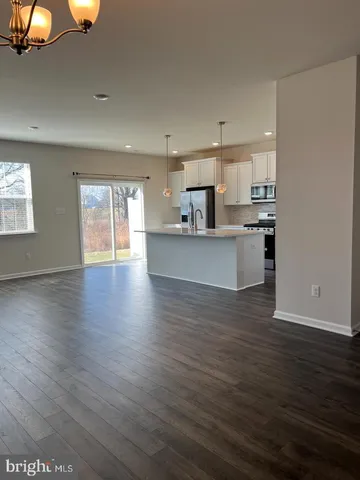 a view of kitchen with sink microwave and stove