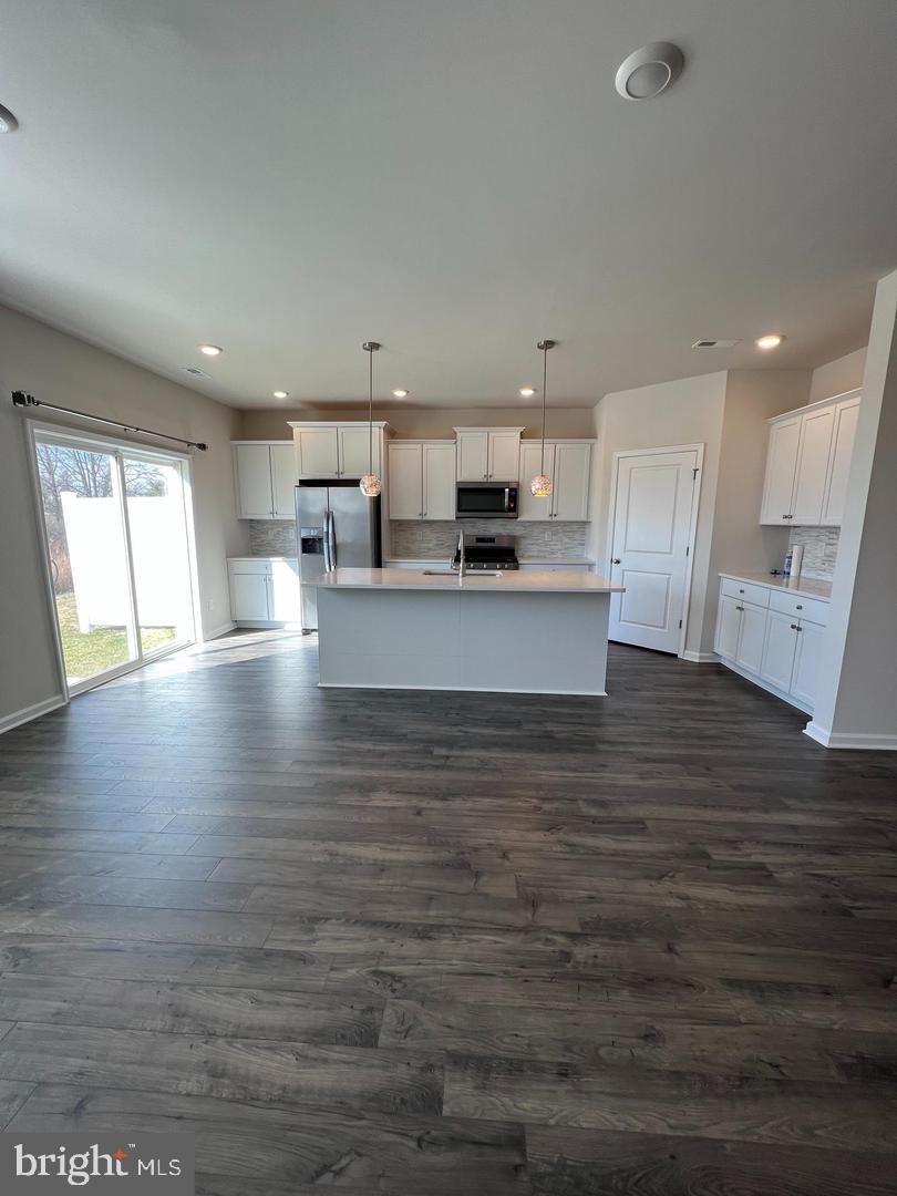 34 Roberta Wy. Medford, NJ 08055 - Photo 5 of 19 a view of kitchen and kitchen with granite countertop wooden floor