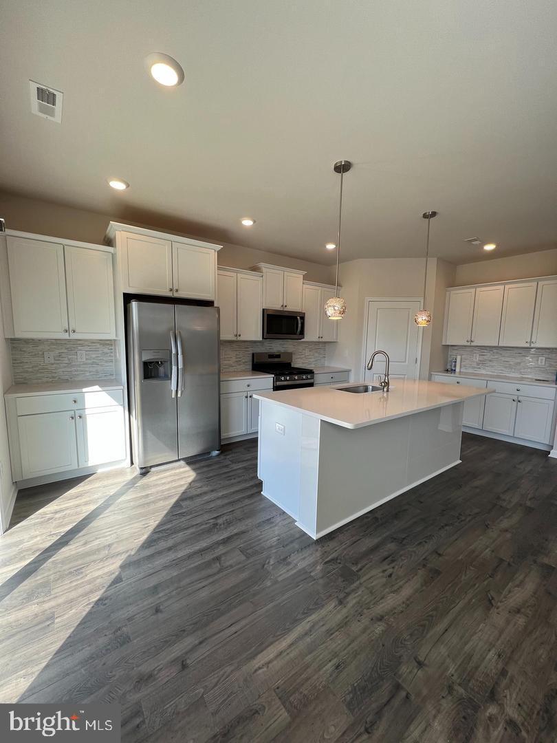 34 Roberta Wy. Medford, NJ 08055 - Photo 6 of 19 a large kitchen with cabinets and stainless steel appliances