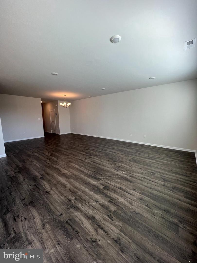 34 Roberta Wy. Medford, NJ 08055 - Photo 7 of 19 a view of an empty room with wooden floor