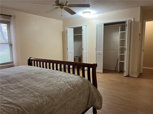 a view of a hallway with a bedroom