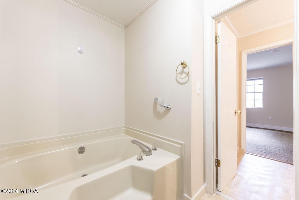 1400 Smith Chapel Road Musella, GA 31066 - Photo 15 of 28 a bathroom with a bathtub