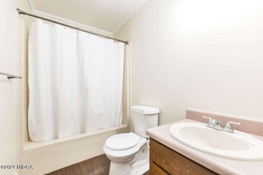 1400 Smith Chapel Road Musella, GA 31066 - Photo 19 of 28 a bathroom with a sink toilet and shower