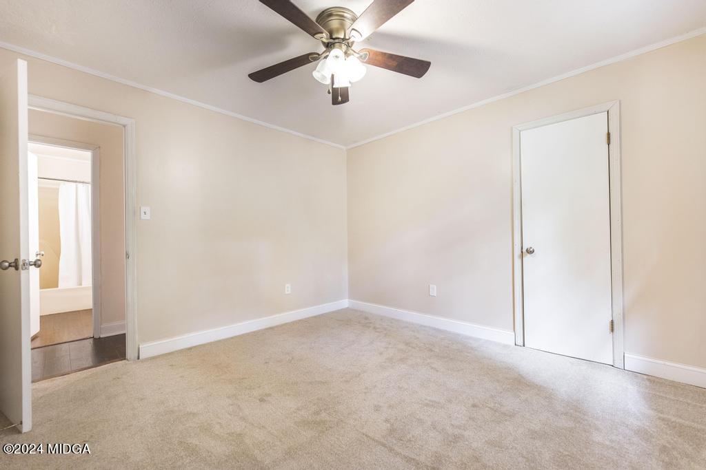 1400 Smith Chapel Road Musella, GA 31066 - Photo 20 of 28 a view of an empty room and chandelier fan