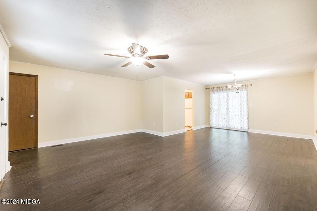 1400 Smith Chapel Road Musella, GA 31066 - Photo 6 of 28 a view of an empty room with a window and wooden floor