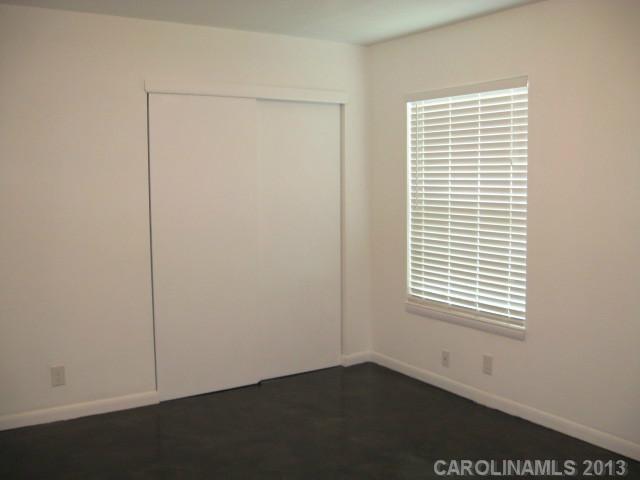 2628 B Park Road Charlotte, NC 28209 - Photo 3 of 6 an empty room with a window