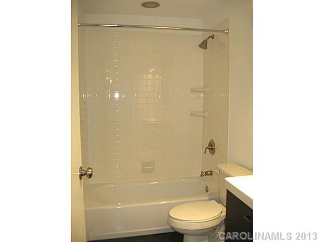 2628 B Park Road Charlotte, NC 28209 - Photo 5 of 6 a bathroom with a toilet a sink and shower