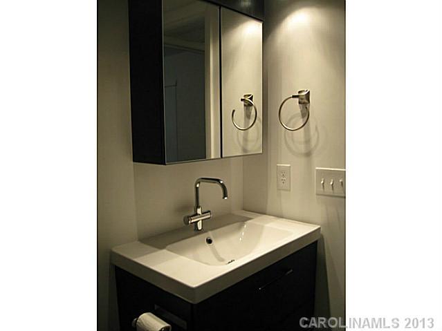 2628 B Park Road Charlotte, NC 28209 - Photo 6 of 6 a bathroom with a sink and a mirror
