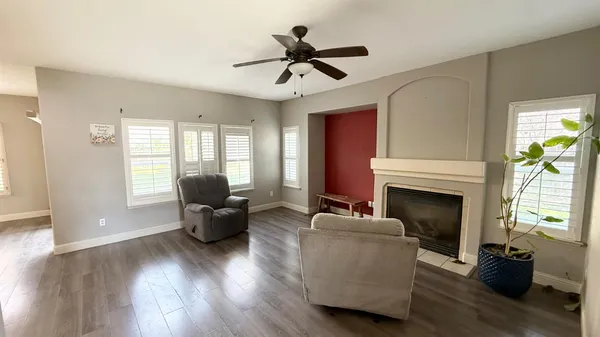 a living room with furniture and a fireplace