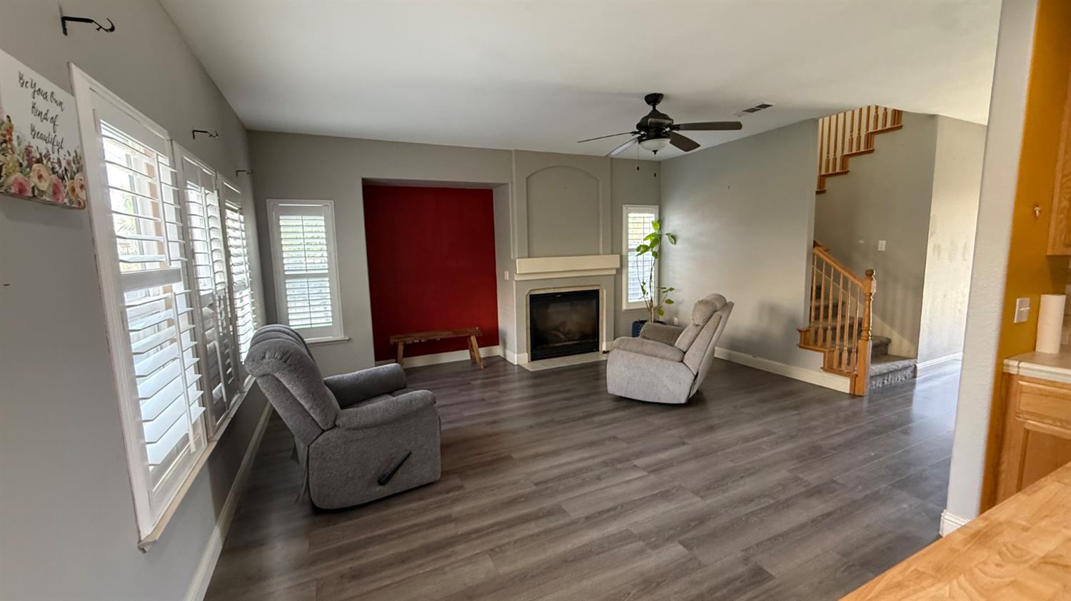 1416 San Rafael Street Los Banos, CA 93635 - Photo 3 of 21 a living room with fireplace furniture and a wooden floor
