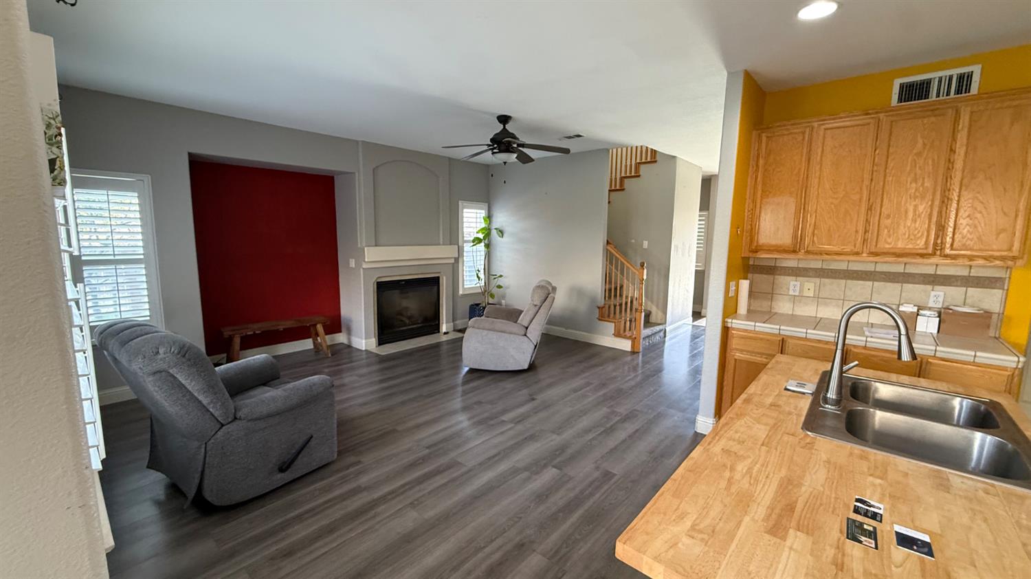 1416 San Rafael Street Los Banos, CA 93635 - Photo 6 of 21 a living room with fireplace furniture and a wooden floor