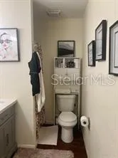 a white toilet sitting next to a bathroom sink