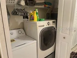 a utility room with dryer and washer
