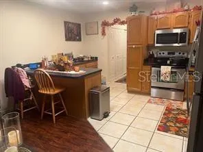a kitchen with stainless steel appliances a stove a sink and a refrigerator
