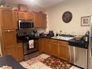 a kitchen with a sink cabinets and appliances