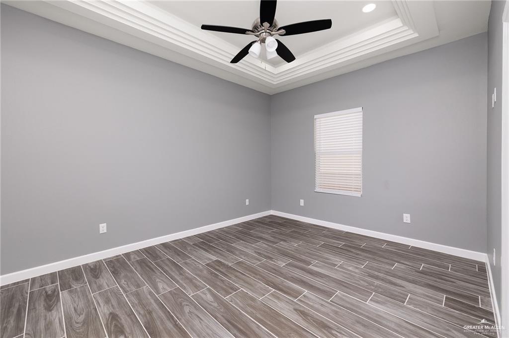 1801 Monaco Drive, Unit 4 San Juan, TX 78589 - Photo 12 of 17 a view of room with window and ceiling fan