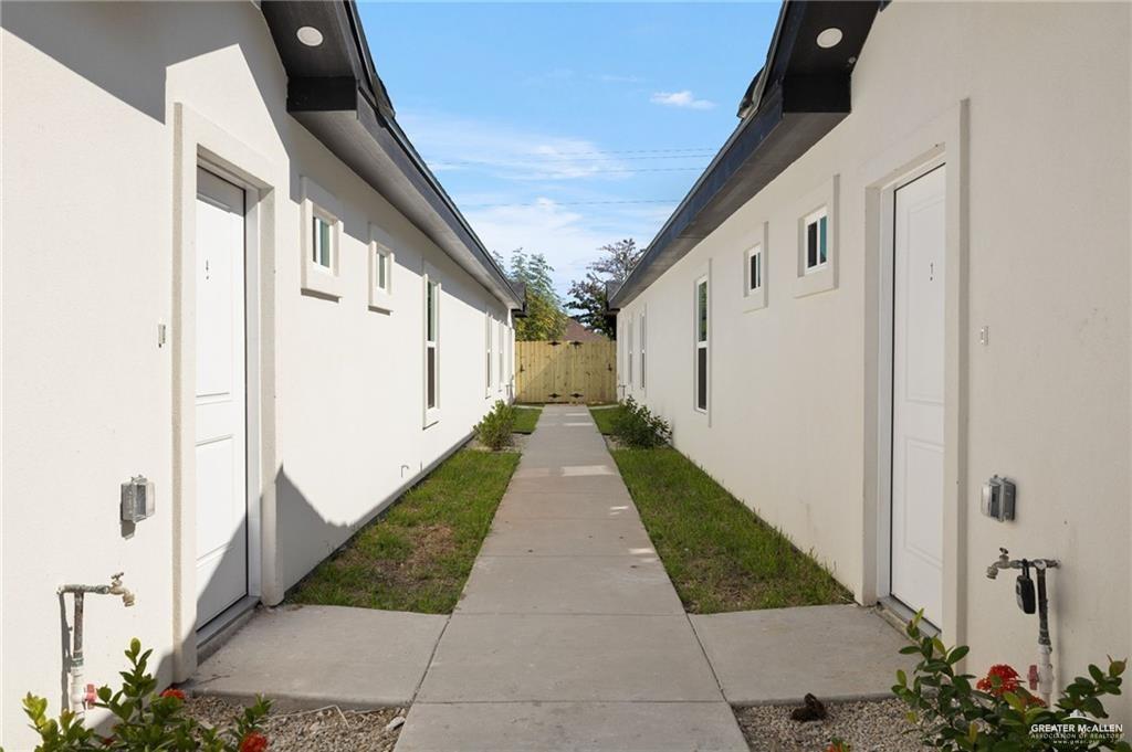1801 Monaco Drive, Unit 4 San Juan, TX 78589 - Photo 3 of 17 a view of a pathway both side of house