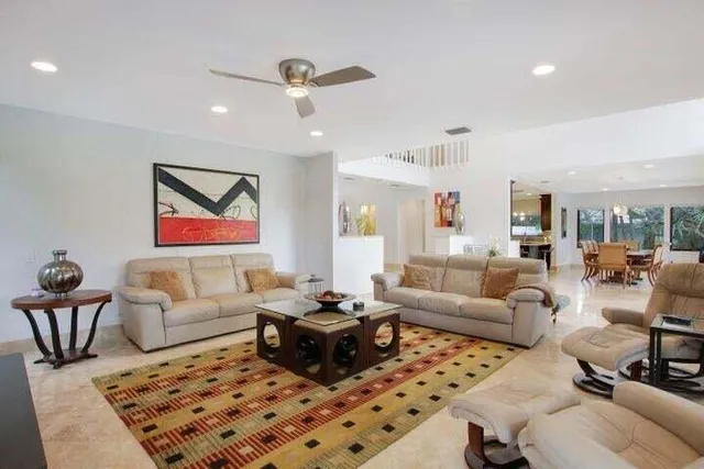 a living room with furniture and a rug