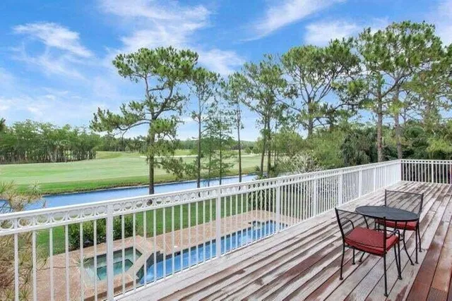 a view of a chairs and table on the deck