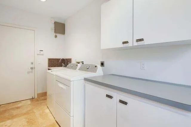 a utility room with dryer and washer