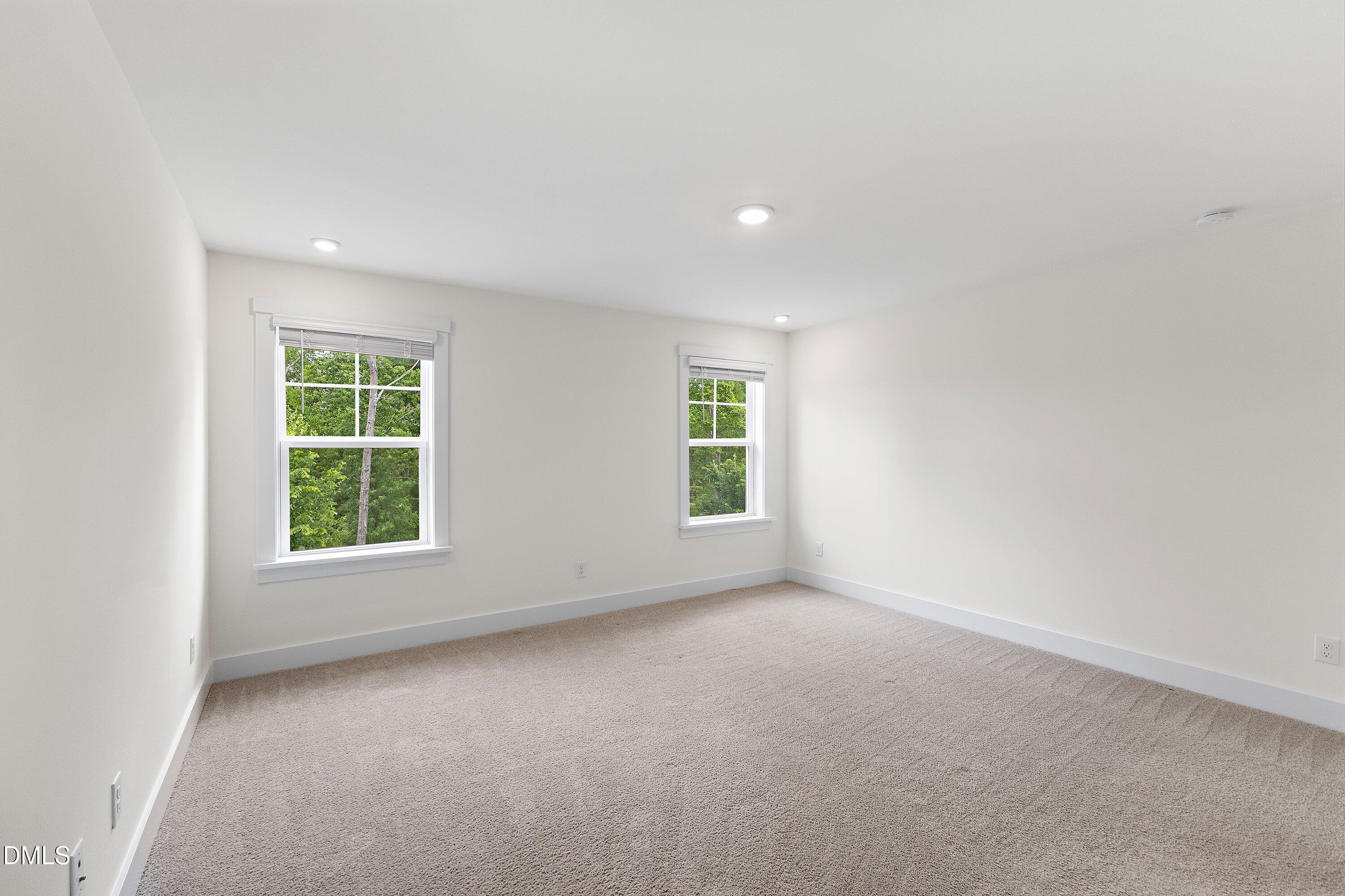156 Sears Ridge Lane Morrisville, NC 27560 - Photo 18 of 49 an empty room with windows