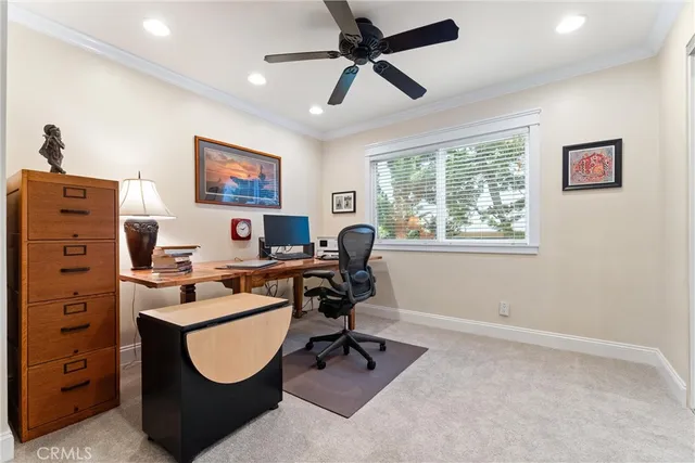 a view of a patio with couches and a fire pit