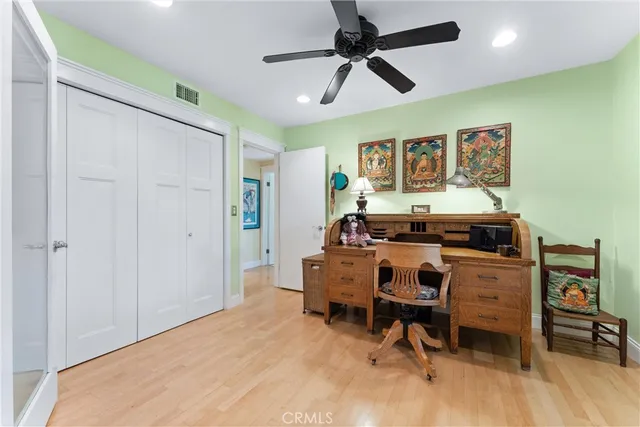 a building outdoor space with patio furniture and potted plants