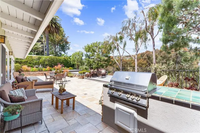 a view of a backyard with sitting area