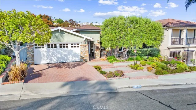 an aerial view of residential houses with yard