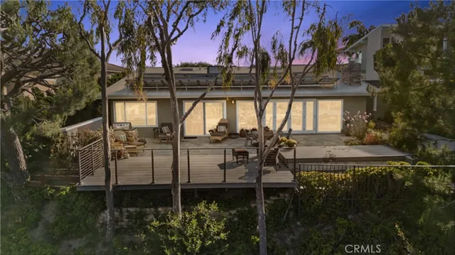aerial view of a house with a yard and garden