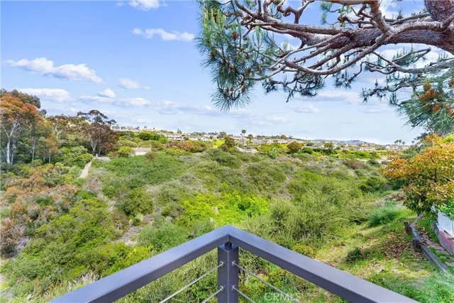 a view of a red door with a red door and small yard