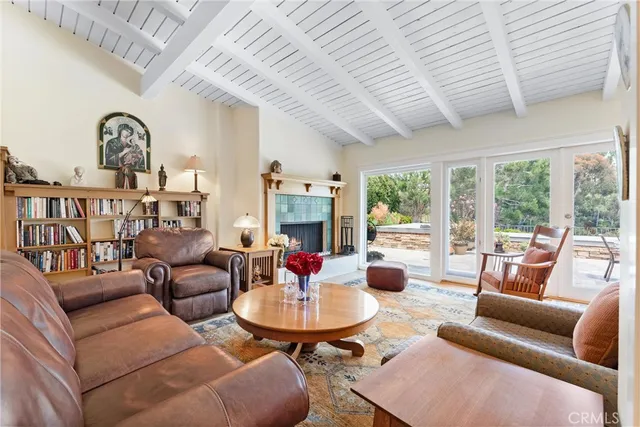 a view of a dining room with furniture a chandelier and wooden floor