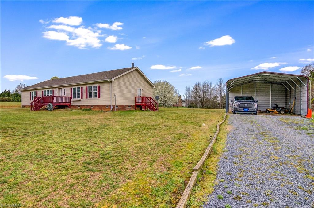 423 Brann Road Browns Summit, NC 27214 - Photo 2 of 34 Side view of home along with 2-car carport
