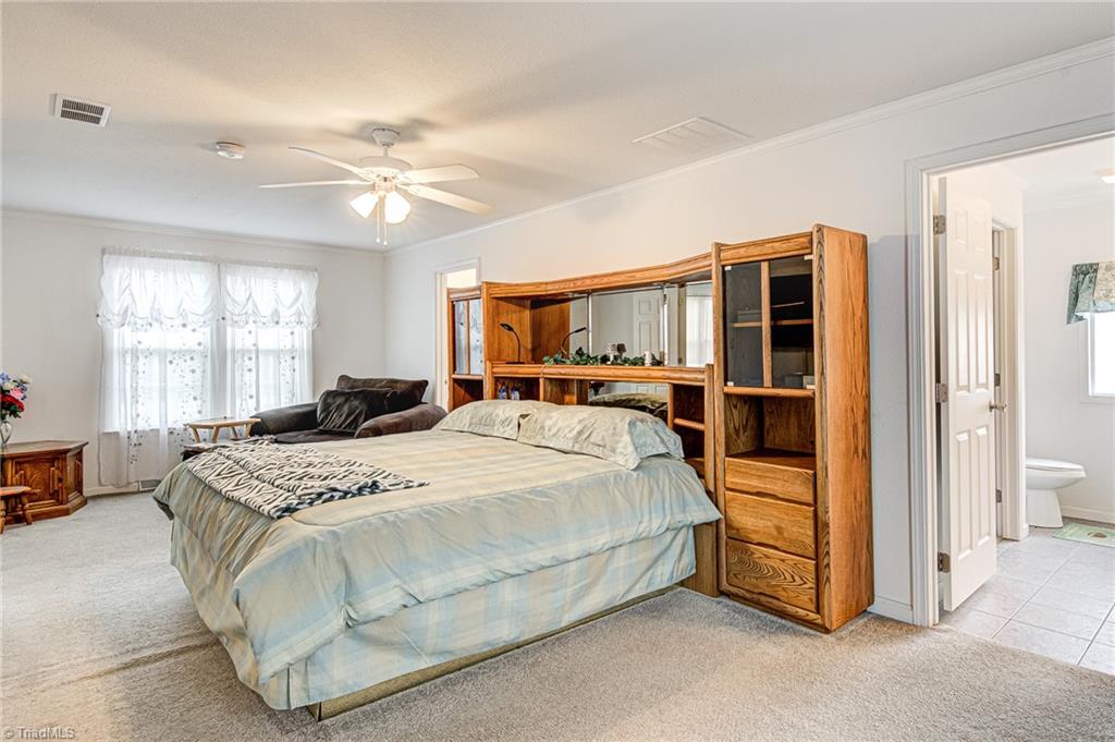 423 Brann Road Browns Summit, NC 27214 - Photo 22 of 34 Primary Bedroom
