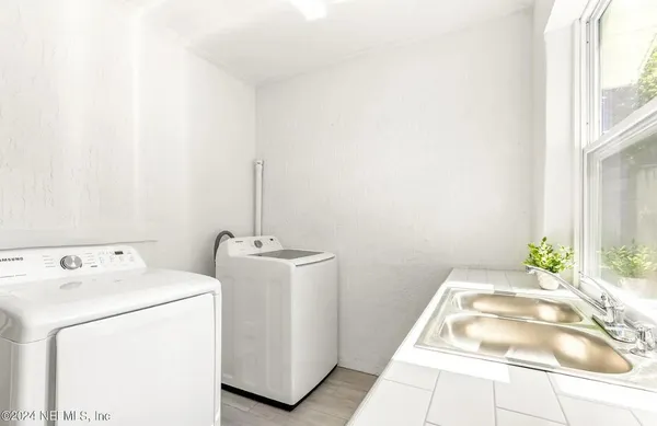 a utility room with dryer and washer